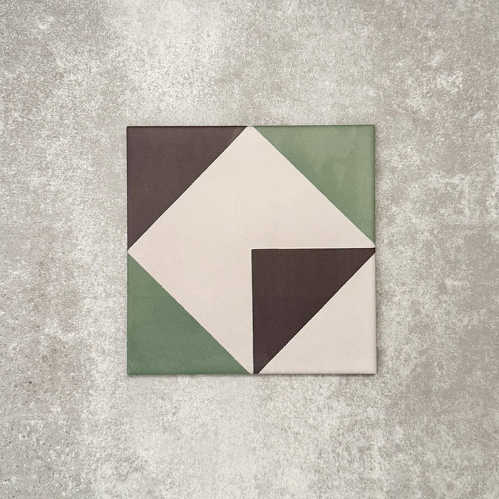 Single Abstract Angles Patterned Tile in a 20x20cm format, featuring a bold geometric design with angular shapes in muted green, deep charcoal and soft cream tones. A contemporary patterned tile ideal for feature walls, floors or statement splashbacks.