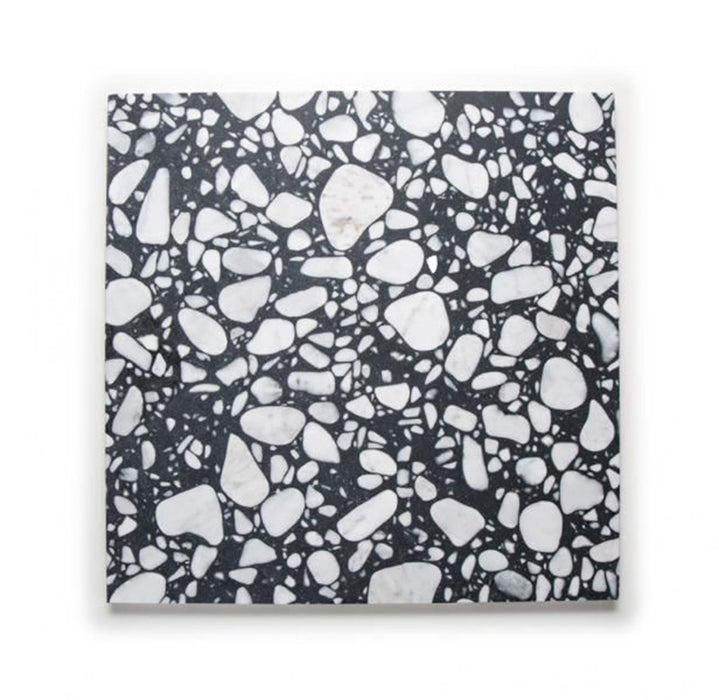 Single Shards Terrazzo Nero 59x59cm matt porcelain wall and floor tile, showcasing a bold terrazzo effect with large white stone fragments set against a deep black base, offering a striking, contemporary surface suitable for both walls and floors in modern interiors.