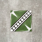 Gilgamesh Green Moroccan style 20x20cm patterned tile, shown as a single tile highlighting the green, black and white geometric star design.