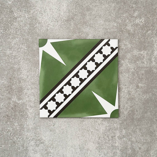 Gilgamesh Green Moroccan style 20x20cm patterned tile, shown as a single tile highlighting the green, black and white geometric star design.