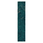 Bora Bora Amun Blue Brick ceramic wall tile in a 6.5 × 32.8cm slim brick format, featuring deep blue-green tones with natural flux glaze variation and subtle surface texture, shown as a single tile on a white background.