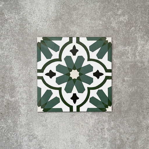 Clara Verde Victorian Moroccan-style porcelain tile in a 20 × 20cm format, shown as a single tile highlighting its bold green geometric pattern and decorative encaustic-effect design.