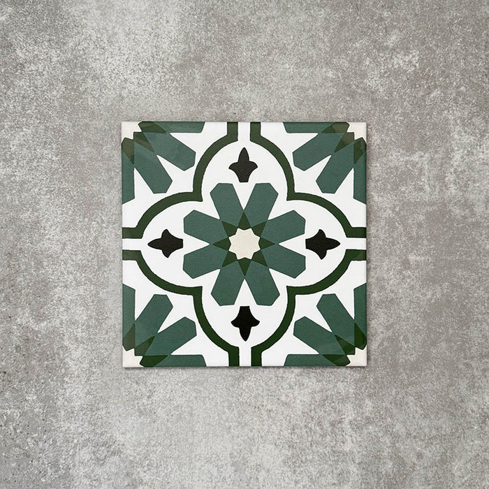 Clara Verde Victorian Moroccan-style porcelain tile in a 20 × 20cm format, shown as a single tile highlighting its bold green geometric pattern and decorative encaustic-effect design.