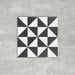 Single Fulham Tile Black & White Victorian-style porcelain tile in a 25 × 25cm format, featuring a bold geometric triangular pattern, shown on a neutral background to highlight the contrasting black and white design suitable for wall and floor use.