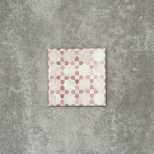 Berber Mequinez Rose 15×15cm Moroccan-style porcelain tile featuring a soft pink and cream geometric pattern on a neutral background.