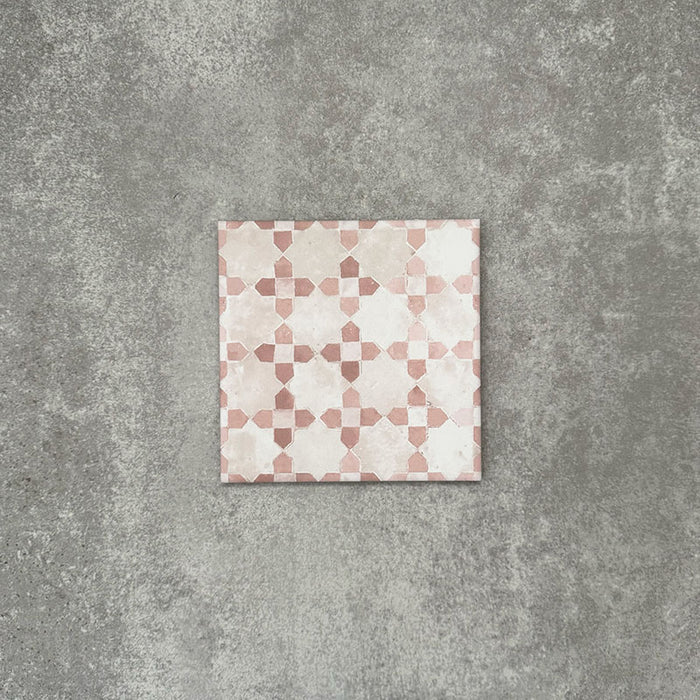 Berber Mequinez Rose 15×15cm Moroccan-style porcelain tile featuring a soft pink and cream geometric pattern on a neutral background.