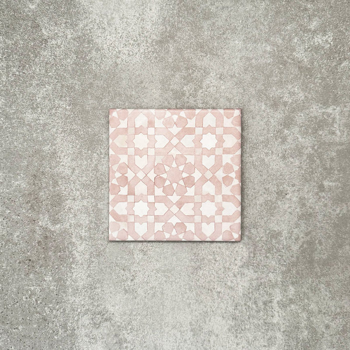 Berber Tetuan Rose 15×15cm Moroccan-style porcelain tile featuring a soft pink and cream geometric pattern on a neutral background.