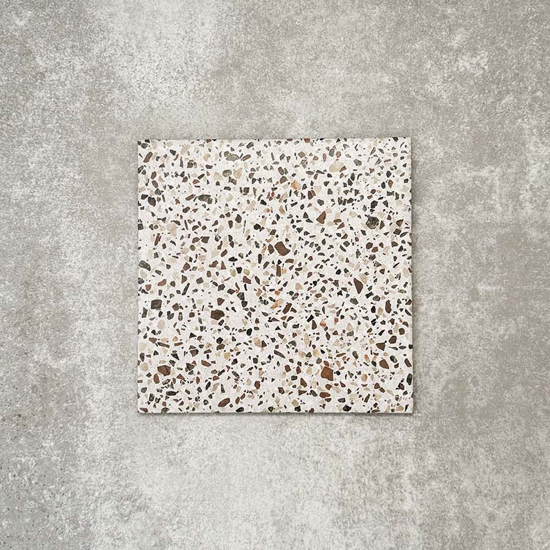 Single Turin Terrazzo Blanco Dots porcelain tile in a 20 × 20cm format, featuring a soft terrazzo-style design with scattered multicoloured stone fragments on a light base, shown on a neutral background to highlight the subtle texture and pattern suitable for wall and floor use.