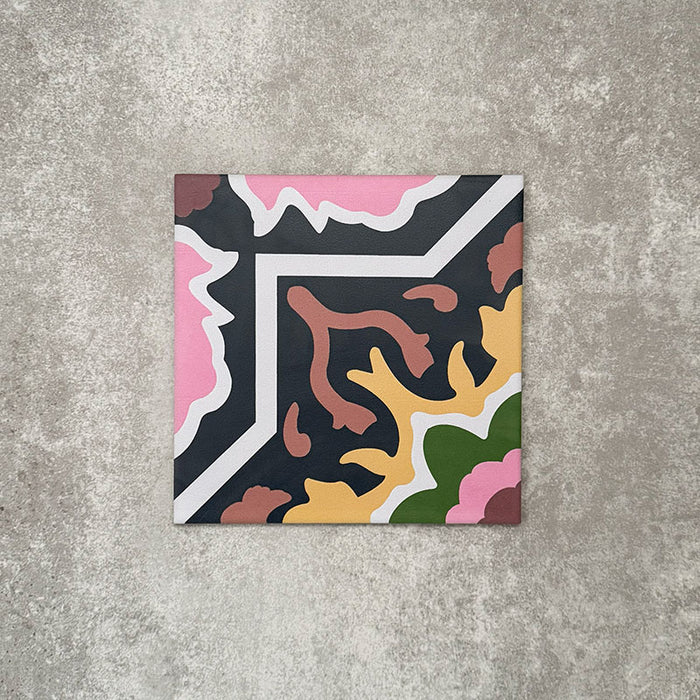 Single Cuba Havana Moroccan-style porcelain tile in a 20×20cm square format, featuring a bold geometric corner pattern in navy, pink, green and mustard tones, shown against a neutral background to highlight the tile’s intricate design and matt finish.