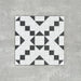 Abbey Black & White A 28×28cm Victorian-style patterned porcelain mosaic tile in a black and white geometric design.