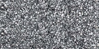 Close-up of Shards Terrazzo Nero 59x118cm matt porcelain wall and floor tile, showcasing a bold black base with varied white aggregate pieces, creating a striking terrazzo effect with natural variation and texture.