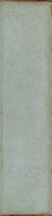 Puzzle Breeze Green Brick Rectified 5x20cm porcelain tile featuring a soft, muted green base with delicate speckling and lightly shaded edges for a subtle handmade look. The slim brick format and rectified edges create a clean, contemporary finish suitable for both walls and floors.