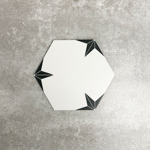Single Polaris Black Star Hexagon Moroccan-style porcelain tile in a 22 × 25cm format, featuring a white hexagonal base with black star detailing, shown on a neutral background to highlight the geometric design suitable for wall and floor use.