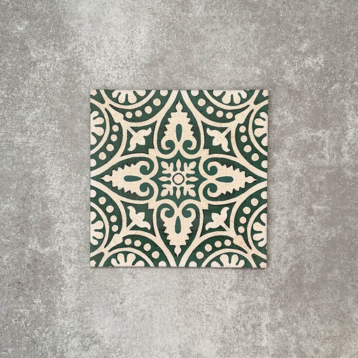Single Cuba Fleur de Lis Moroccan-style porcelain tile in a 20×20cm square format, featuring an intricate decorative motif in soft green and white tones, shown against a neutral background to highlight the tile’s classic encaustic-style pattern and fine detailing.