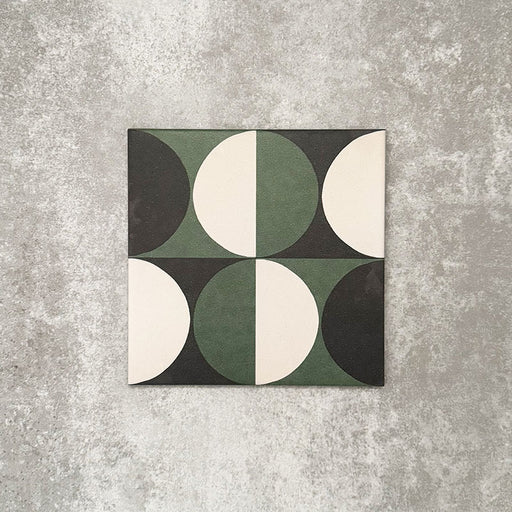 Single Abstract Circles Patterned Tile in a 20x20cm format, featuring a bold geometric design with alternating circular segments in deep green, charcoal and soft cream tones. A contemporary patterned tile ideal for feature walls, floors or statement splashbacks.