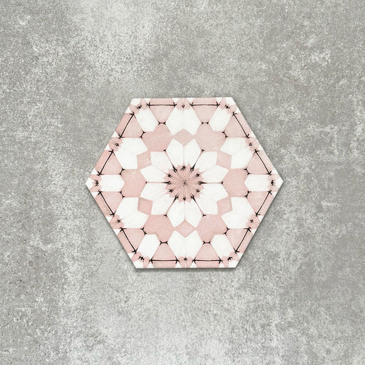 Single Medina Dusty Pink Moroccan-style hexagon porcelain tile, 18.7 × 21.6 cm, featuring a soft geometric pattern in dusty pink and white tones on a neutral background.