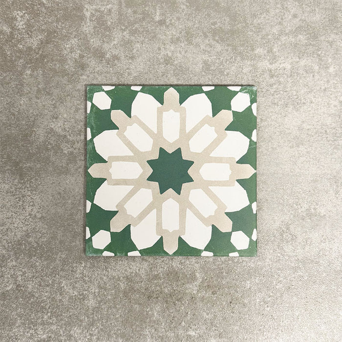 Souk Green D 20×20cm Moroccan-style porcelain tile with a green, white and beige geometric pattern.