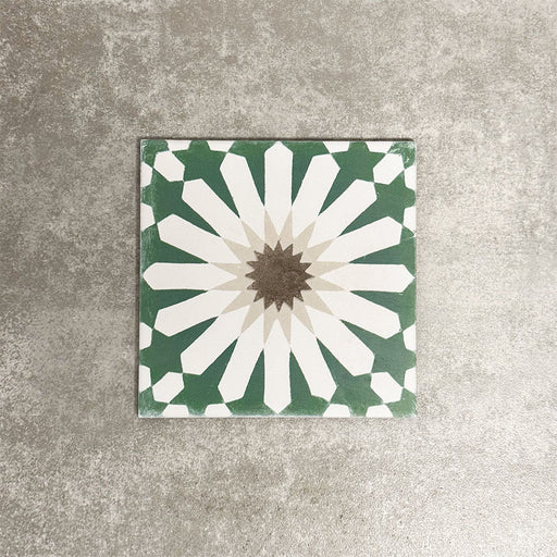 Souk Green B 20×20cm Moroccan-style porcelain tile with a green, white and beige geometric pattern.