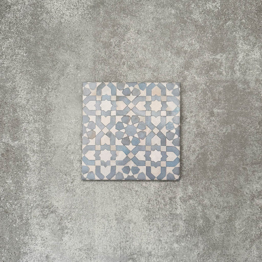 Berber Tetuan Blue 15×15cm Moroccan-style porcelain tile featuring a soft blue and cream geometric pattern on a neutral background.
