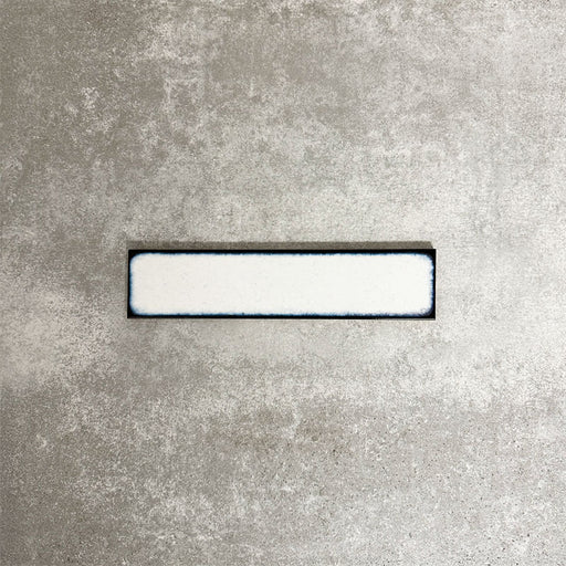 Alchemy Magma White 6.5×30cm ceramic wall tile with a glossy white finish.