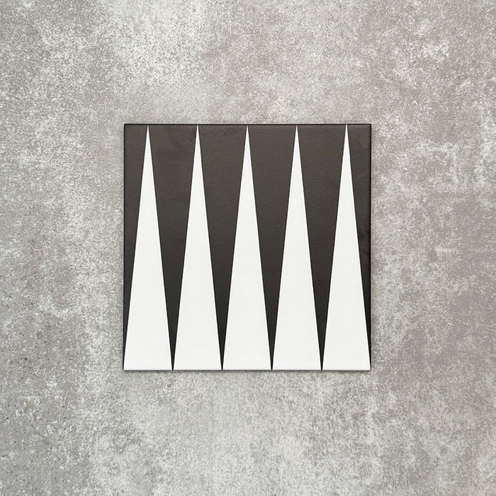 Single Almeria Backgammon Moroccan-style porcelain tile in a black and white geometric pattern, 20x20cm, suitable for wall and floor use.