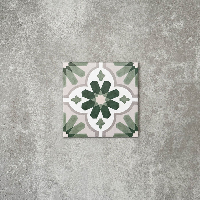Clara Jade Mini Victorian Moroccan-style porcelain tile in a 15 × 15cm format, shown as a single tile highlighting its green geometric pattern and decorative encaustic-effect design.