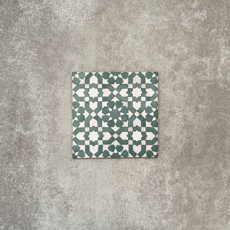 Berber Tetuan Green 15×15cm Moroccan-style porcelain tile featuring a green and cream geometric pattern on a neutral background.