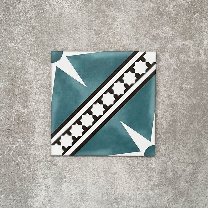 Gilgamesh Blue Moroccan style 20x20cm patterned tile, shown as a single tile highlighting the blue, black and white geometric star design.