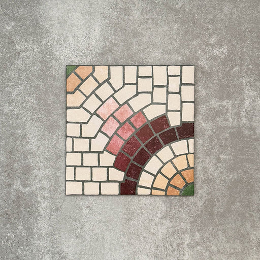 Single Cuba La Calle Moroccan-style porcelain tile in a 20×20cm square format, featuring an intricate mosaic-style circular motif in soft white, terracotta, burgundy and green tones, shown against a neutral background to highlight the tile’s detailed pattern and encaustic-style finish.