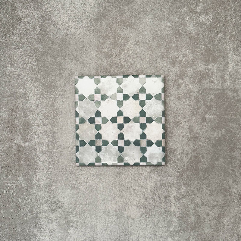 Berber Mequinez Green 15×15cm Moroccan-style porcelain tile featuring a soft green and cream geometric pattern on a neutral background.