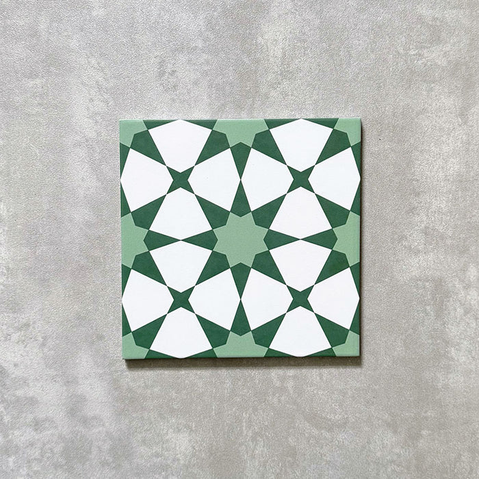 Agadir Green Moroccan-style 20x20cm porcelain tile featuring a geometric star pattern in soft green and white, shown as a single tile on a neutral background.