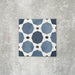 Viscount Sapphire 20×20cm Victorian-style porcelain wall and floor tile featuring a blue and white geometric pattern with octagonal motifs, photographed as a single tile on a neutral grey background.