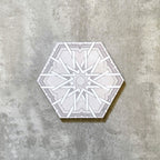 Single Medina Hormuz Snow White Moroccan-style hexagon porcelain tile, 18.7 × 21.6 cm, featuring a crisp star-inspired geometric pattern in white and soft grey tones on a neutral background.