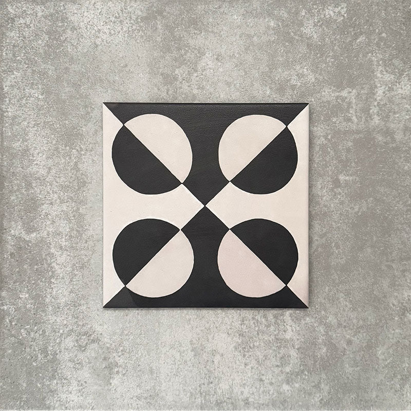 Single Abstract Illusion Noir Patterned Tile in a 20x20cm format, featuring a bold optical illusion design with curved shapes in deep black and soft cream tones. A striking patterned tile ideal for feature walls, floors or statement splashbacks.