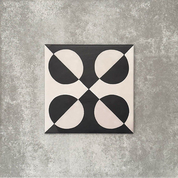 Single Abstract Illusion Noir Patterned Tile in a 20x20cm format, featuring a bold optical illusion design with curved shapes in deep black and soft cream tones. A striking patterned tile ideal for feature walls, floors or statement splashbacks.