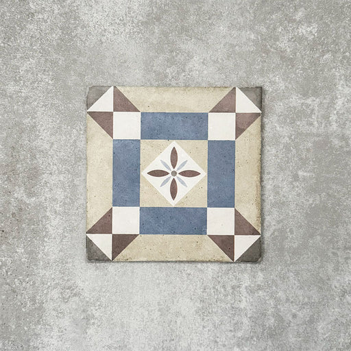 Viscount Harley Street 20×20cm Victorian-style porcelain wall and floor tile featuring a geometric square and floral motif in soft blue, beige, warm grey and white tones, photographed as a single tile on a neutral grey background.