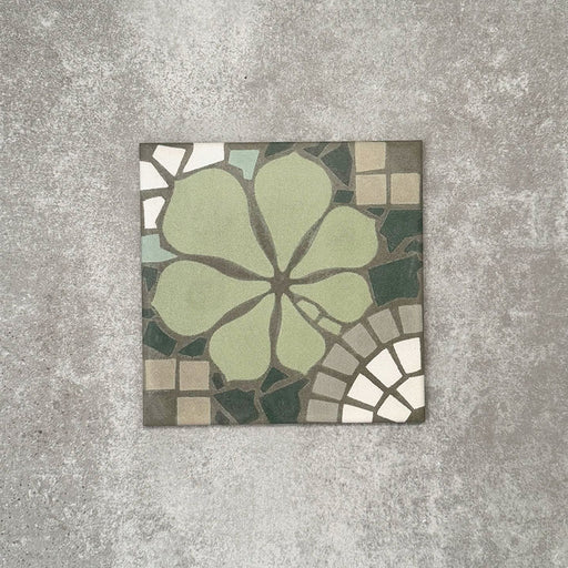 Single Nantes Green Moroccan-style tile in a 20x20cm format, featuring a floral-inspired motif in soft green tones with mosaic-style detailing in muted neutrals and white. A decorative patterned tile ideal for feature walls, floors or statement splashbacks.