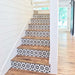 Staircase featuring Agadir Black & White Mini Moroccan-style 15x15cm porcelain tiles on the risers, showcasing a bold geometric star pattern, paired with natural wooden treads for a striking contrast.