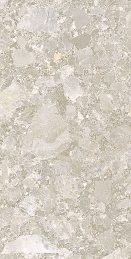 Close-up of Essentials Terrazzo Stone Avorio 60x120cm terrazzo effect porcelain tile, showcasing soft beige and ivory tones with varied stone fragments and a natural, blended surface design.
