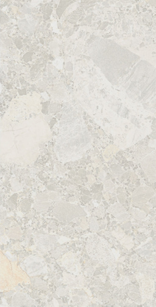 Close-up of Essentials Terrazzo Stone Blanca 60x120cm terrazzo effect porcelain tile, showcasing soft white and beige tones with varied stone fragments and a natural, blended surface pattern.