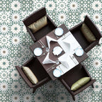 Dining area floor featuring Souk Green B 20×20cm Moroccan-style porcelain tiles arranged in a green and white geometric pattern.