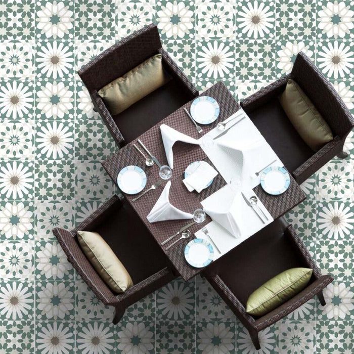 Dining area floor featuring Souk Green A 20×20cm Moroccan-style porcelain tiles arranged in a green and white geometric pattern.