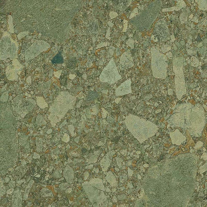Close-up of Terrazerri Terrazzo Green 60x60cm porcelain tile featuring a terrazzo effect in soft sage green tones. The design combines large and small stone fragments with subtle warm brown flecks, creating a natural, contemporary surface with depth and texture for walls and floors.