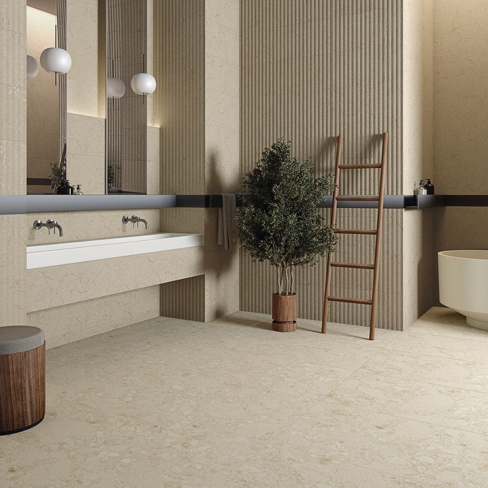 Modern bathroom featuring Terrazerri Terrazzo Ivory 60x60cm porcelain tiles on the floor and walls. The soft ivory terrazzo effect creates a warm, elegant backdrop, complemented by textured fluted wall panels, minimalist floating vanity, timber accents and contemporary lighting for a calm, spa-inspired interior.