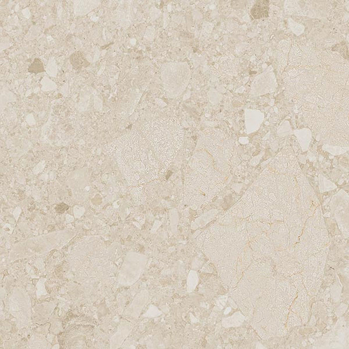 Close-up of Terrazerri Terrazzo Ivory 60x60cm porcelain tile featuring a soft ivory terrazzo effect. The design blends cream and beige stone fragments with delicate tonal variation, creating a warm, understated surface ideal for modern walls and floors.