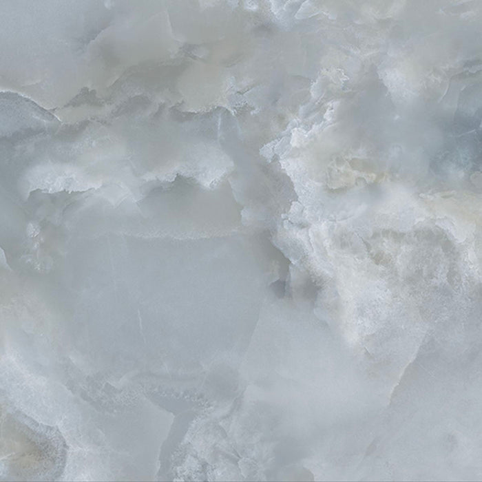 Close-up of Thebes Blue Honed Matt Onyx 60x60cm porcelain tile featuring soft blue onyx-effect veining with layered white, grey and pale blue tones. The honed matt finish creates a luxurious natural stone look, perfect for bathroom walls, feature walls and elegant interiors.