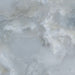 Close-up of Thebes Blue Honed Matt Onyx 60x60cm porcelain tile featuring soft blue onyx-effect veining with layered white, grey and pale blue tones. The honed matt finish creates a luxurious natural stone look, perfect for bathroom walls, feature walls and elegant interiors.