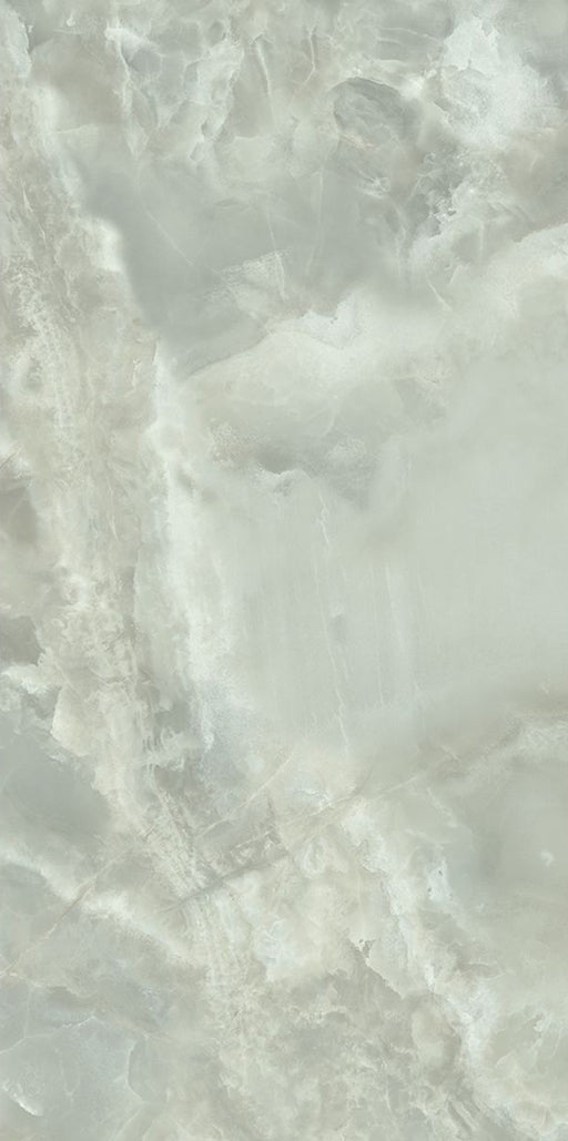 Close-up of Thebes Green Honed Matt Onyx 60x120cm porcelain tile featuring soft green onyx-effect veining with cloudy white and pale sage tones. The honed matt finish creates a natural stone look, ideal for bathroom walls, feature walls and luxurious interior spaces.