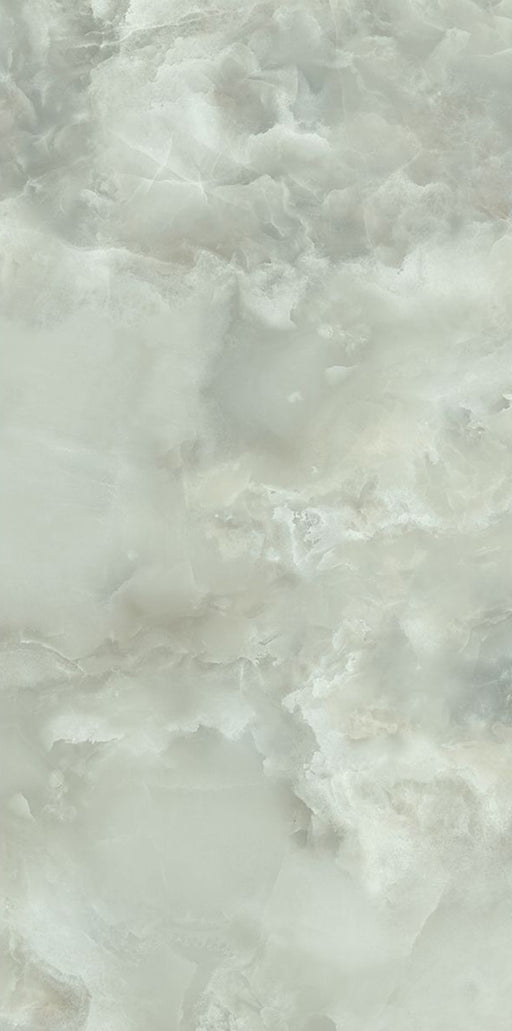 Close-up of Thebes Green Honed Matt Onyx 60x120cm porcelain tile featuring soft green onyx-effect veining with cloudy white and pale sage tones. The honed matt finish creates a natural stone look, ideal for bathroom walls, feature walls and luxurious interior spaces.