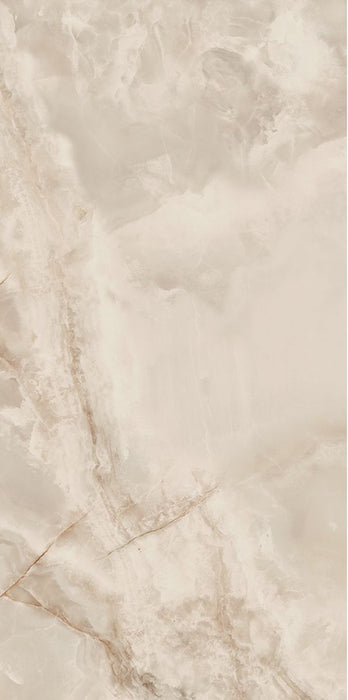 Close-up of Thebes Ivory Honed Matt Onyx 60x120cm porcelain tile featuring soft ivory onyx-effect veining with warm cream, beige and subtle golden tones. The honed matt finish creates a luxurious natural stone look, ideal for bathroom walls, feature walls and elegant interior spaces.
